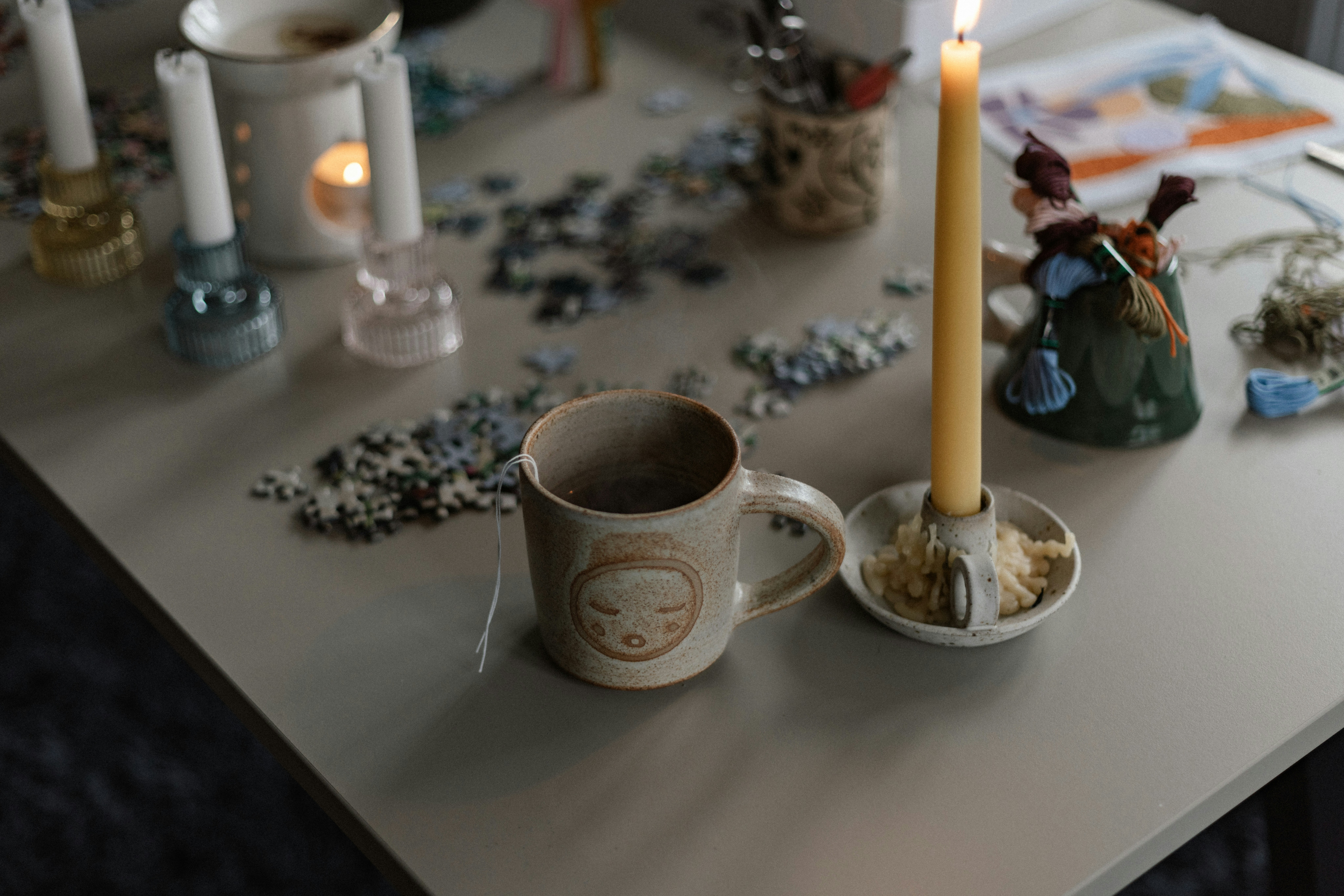 natural ways to reduce stress cup of tea and candle on table