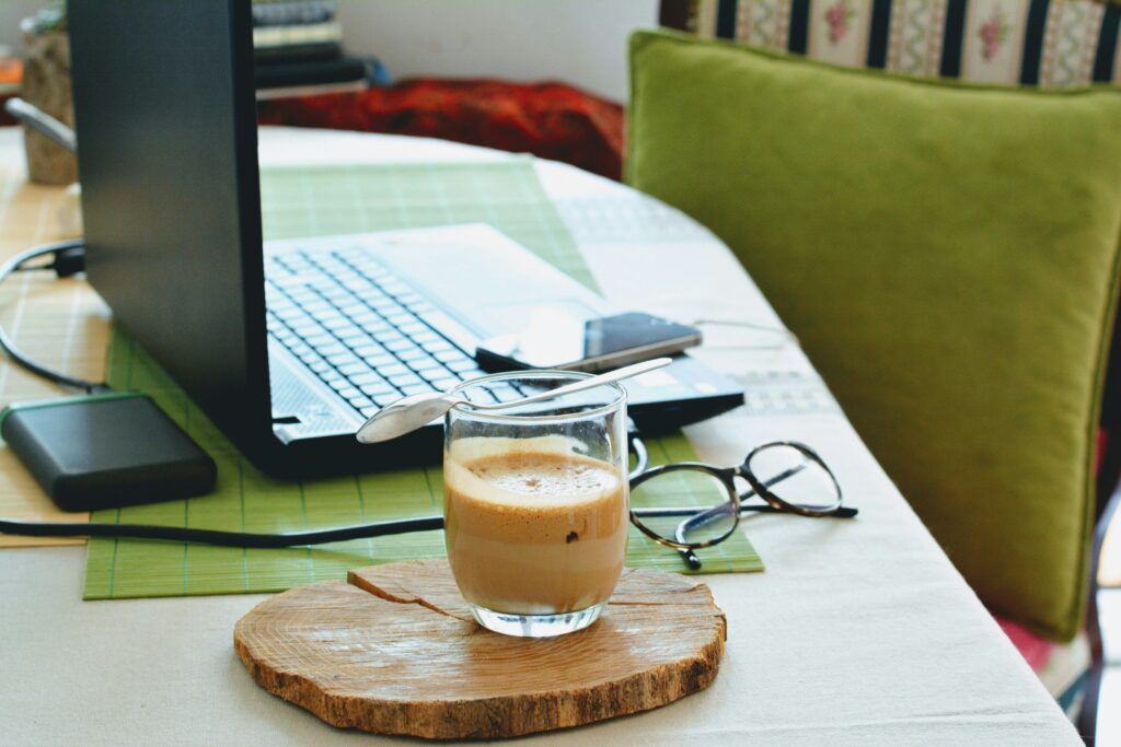 investing for beginners 2025 - calm workspace with coffee and notebook