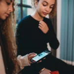 young person using investment app on phone
