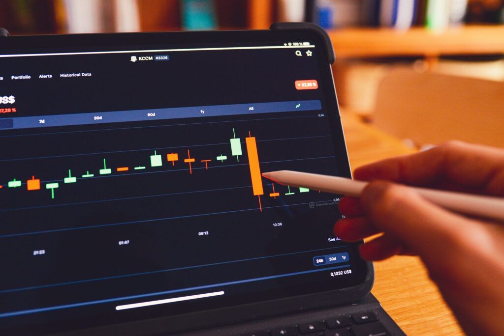 investing for beginners 2025 - laptop screen showing stock graph