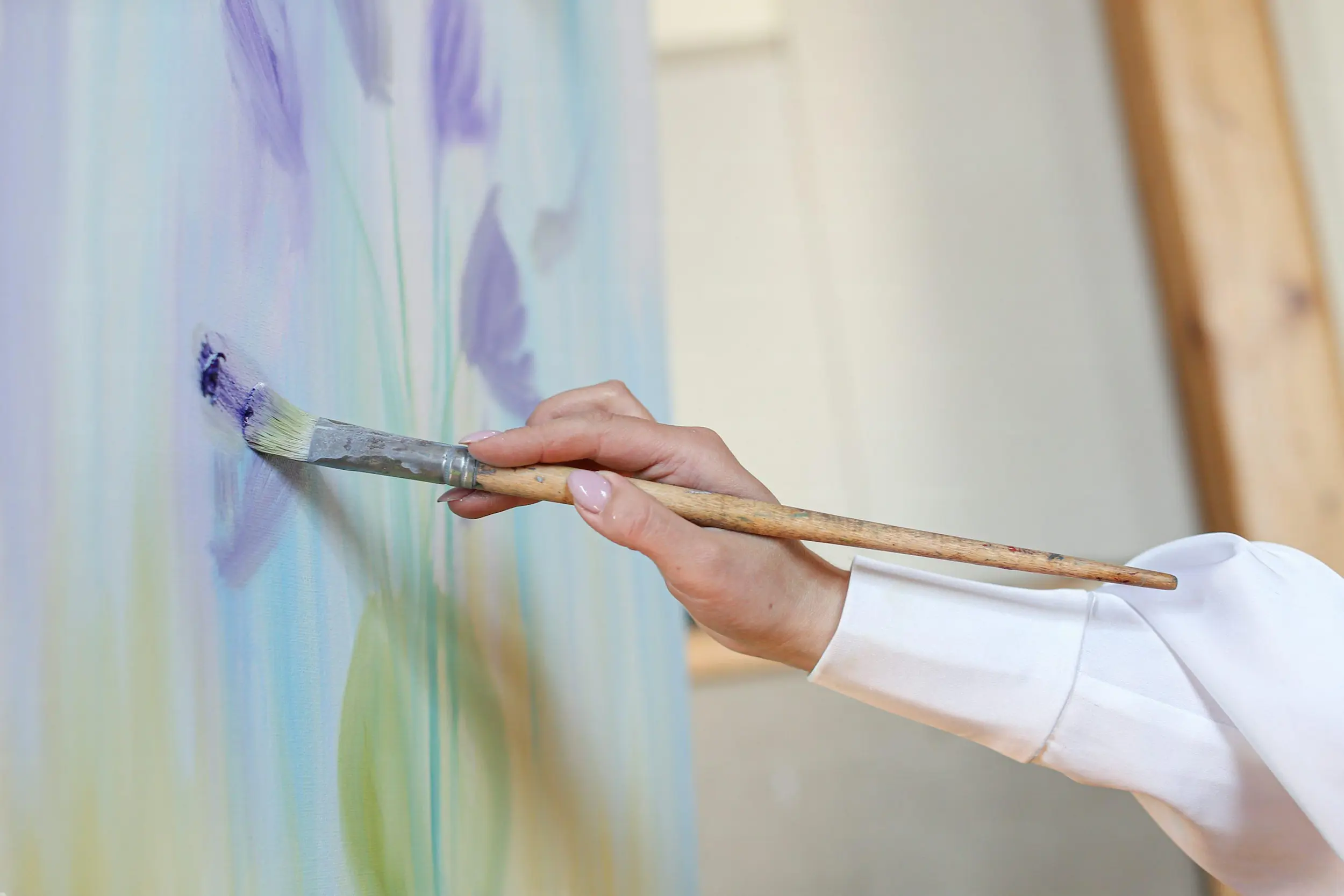 hands painting wall