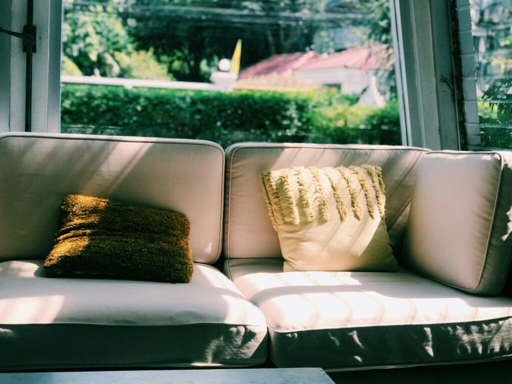sunlight through window over sofa