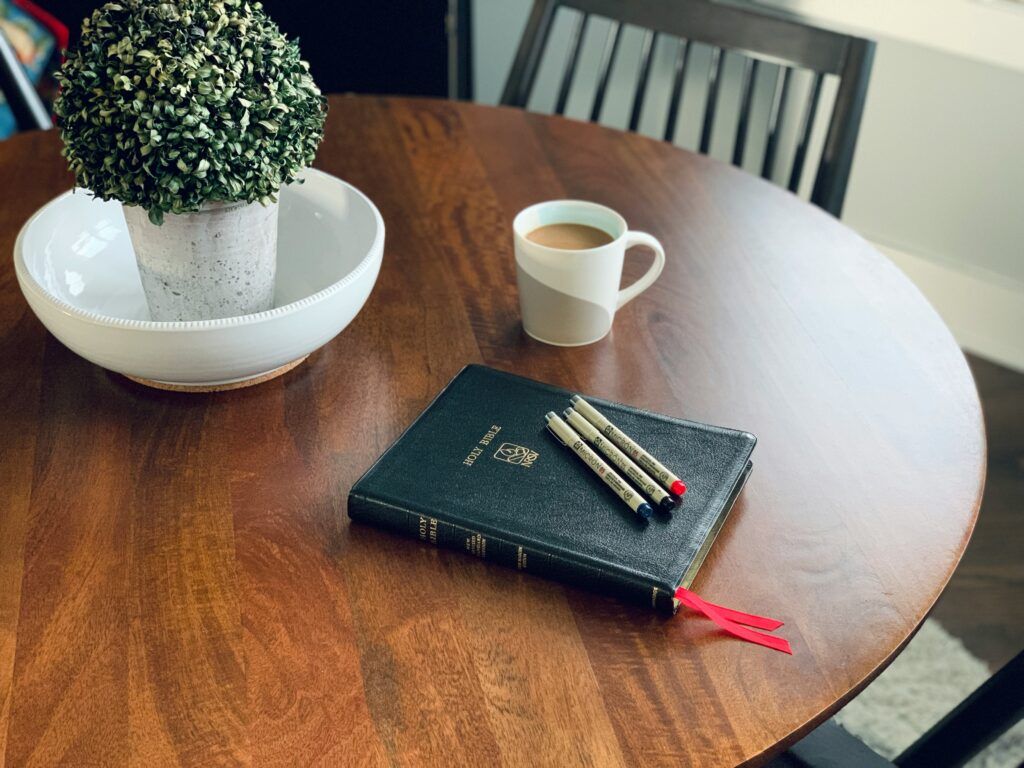 notebook and breakfast on table