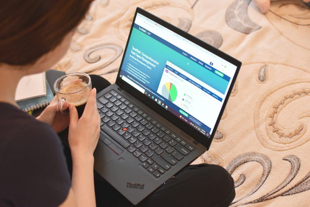 person budgeting on laptop
