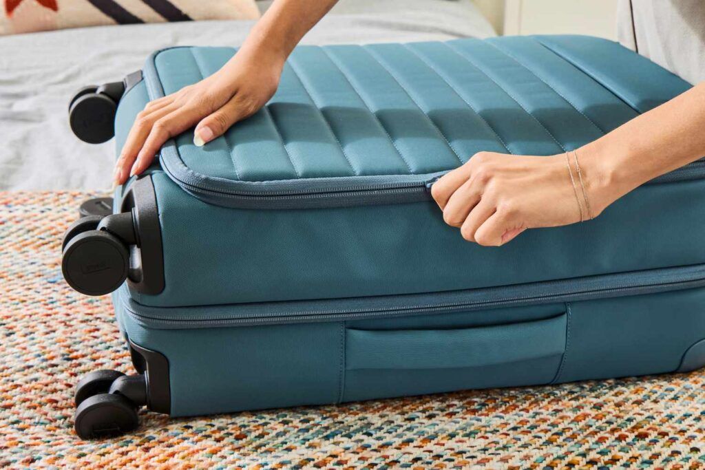 traveler closing minimalist suitcase