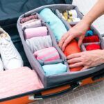 suitcase with neatly rolled clothes