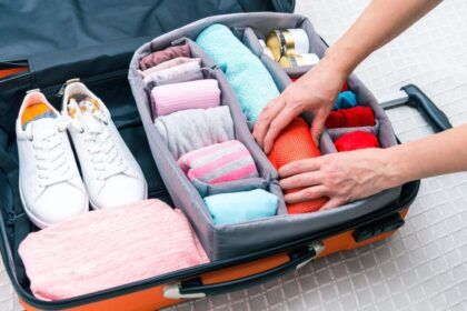 suitcase with neatly rolled clothes